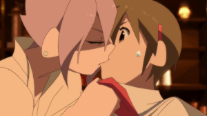 Quite the agressive kiss...